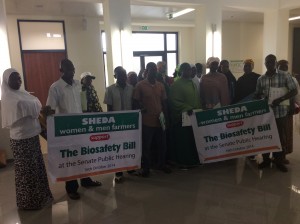 A group displaying placards calling for the quick passage of the bill