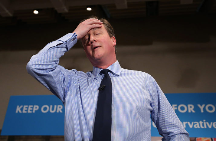 Stepping down:  British Prime Minister David Cameron wipes away some sweat as he speaks to business leaders at a recent forum in London. Photo credit: Peter Macdiarmid/Getty Images