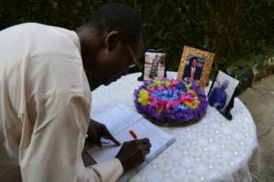 First National Vice President, Luka Bulus Achi, signing the condolence register