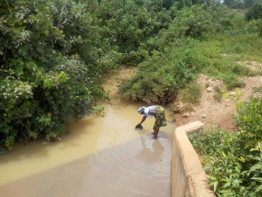 A woman fetching water for drinking